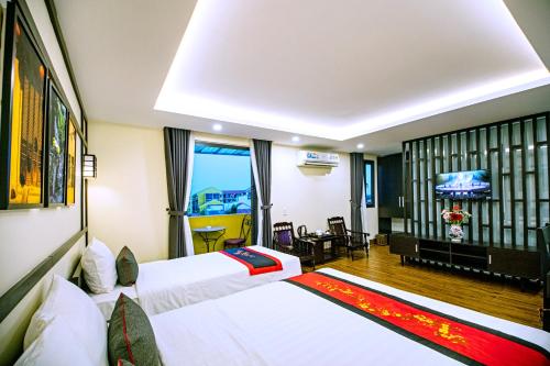 Postel nebo postele na pokoji v ubytování Hoi An Riverland Villa - Hoi An Center
