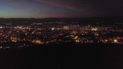 a view of a city lit up at night at Penzion hrad Doubravka in Teplice