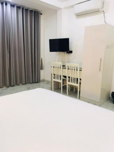 TV a/nebo společenská místnost v ubytování Burberry residencies