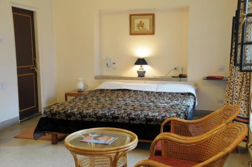 Una cama o camas en una habitación de Hotel Jai Niwas
