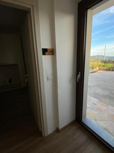 a door leading to a room with a window at Cottage Cilento B&B in Trentinara
