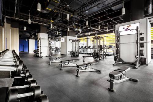 a gym with rows of chairs and machines at JW Marriott Edmonton ICE District in Edmonton