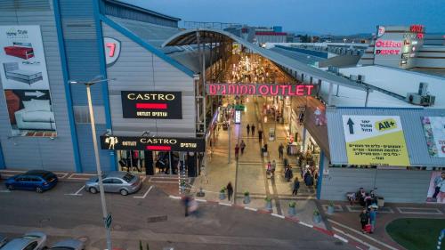 an overhead view of a shopping mall with people in it at Boutique Thomas בוטיק תומאס in Haifa