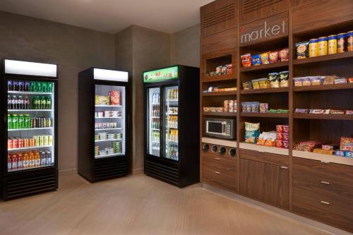 a grocery store with two refrigerators in a room at TownePlace Suites by Marriott Oshawa in Oshawa