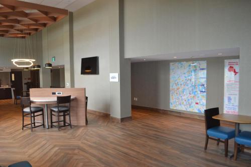 a meeting room with a table and chairs and a projection at TownePlace Suites by Marriott Oshawa in Oshawa
