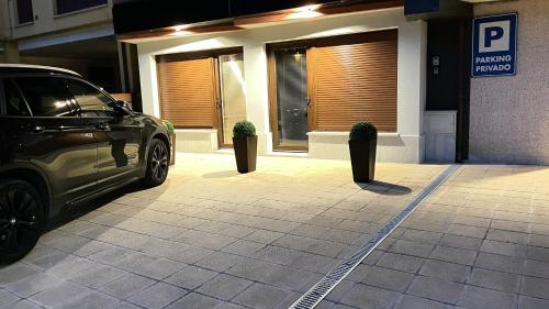 a car parked in front of a building at Lapaserina-A in Arenas de Cabrales
