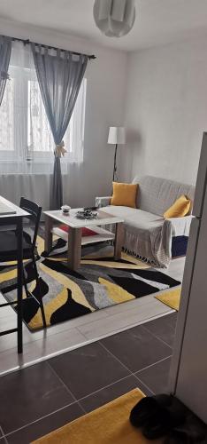 a living room with a couch and a table at Sweet Dreams RD in Travnik