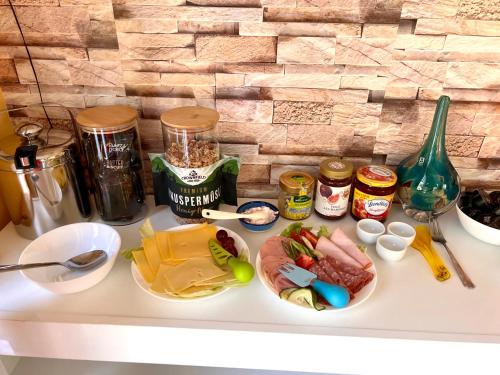 a white counter with food ingredients on it at Casa Rehman in Ratzeburg