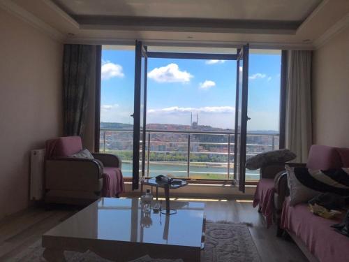 a living room with a large window with a view at Golden horn view apartment in Istanbul