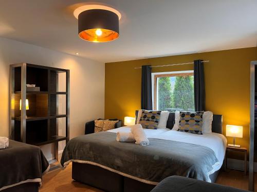 a bedroom with a large bed and a window at Chalet Rubicon in Les Houches