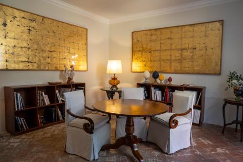 a dining room with a wooden table and chairs at Albergo Pietrasanta in Pietrasanta