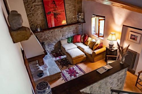 an overhead view of a living room with a couch at Tuscan Countryside Paradise with Pool in Cavriglia
