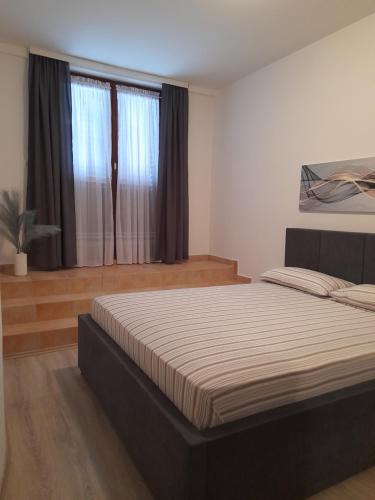 a bedroom with a large bed in a room at Villa Milan in Vinkuran