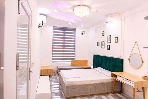 a white room with a bed and a window at Happiest Homestay 2 - Manor Crown Hue in Thôn Trường Giang