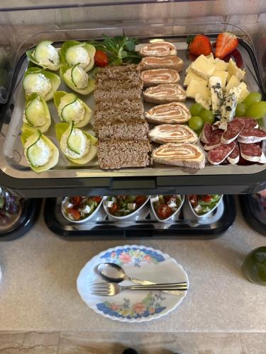 a tray filled with different types of food on a table at Irena in Korbielów