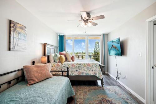 a bedroom with a bed and a window at Trillium 3A - Premier in St. Pete Beach