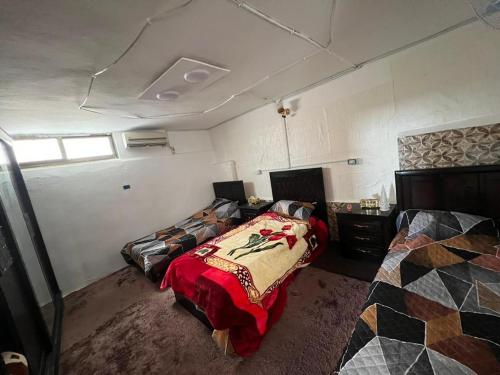 a bedroom with two beds in a room at Elegant housing in Jerash