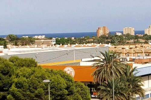a view of a city with buildings and trees at San juan de Alicante 450 € la Semana in San Juan de Alicante