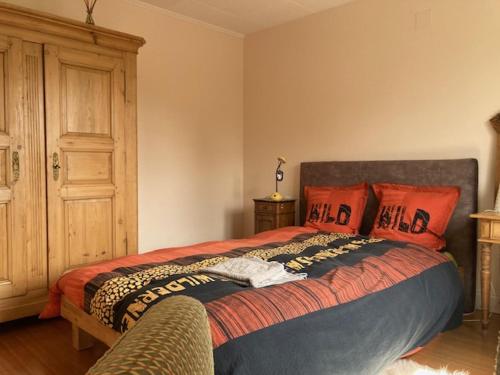 Postel nebo postele na pokoji v ubytování Les Pommiers - Chambres climatisées