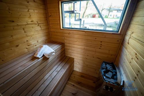 an inside of a sauna with a window at Domki na wodzie - Houseboats Zalesie with sauna in Zalesie