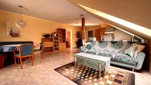 a living room with a couch and a table at Ferienwohnung Brenner in Bruck an der Mur