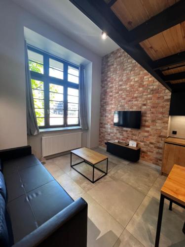 Televízia a/alebo spoločenská miestnosť v ubytovaní Property Apart - plac Jana Pawla II Centrum
