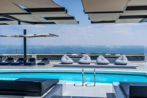 a pool on the top of a building at Abrazo Villas in Imerovigli