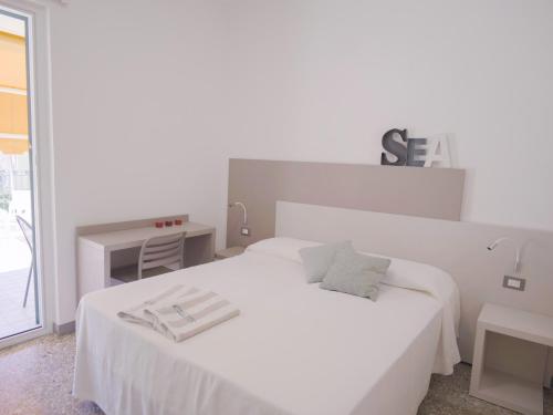 Postel nebo postele na pokoji v ubytování Hotel Liliana