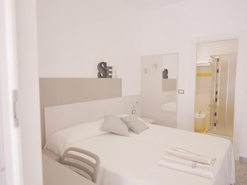 Postel nebo postele na pokoji v ubytování Hotel Liliana