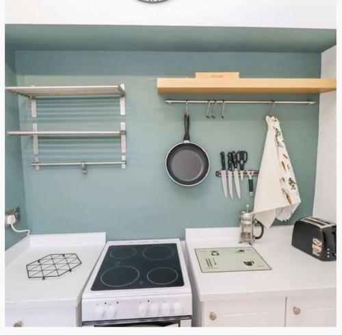 a kitchen with a stove and a counter top at CoastGuard Cottage 3 Bed House Pet Friendly, Close to Spurn Contractors Welcome in Hull