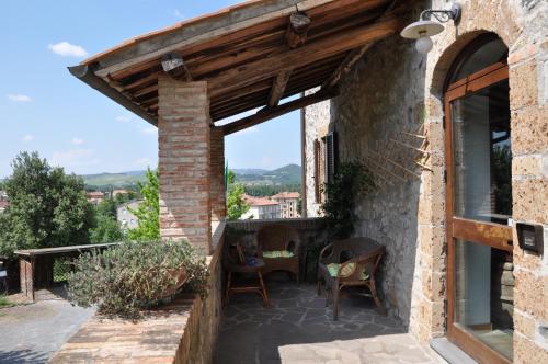 a patio of a house with a wooden roof at Villa Acquafredda in Orvieto