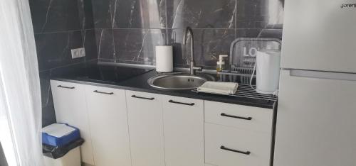 a kitchen with a sink and a counter top at Sweet Dreams RD in Travnik