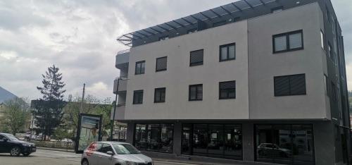 a building with a car parked in front of it at Sweet Dreams RD in Travnik