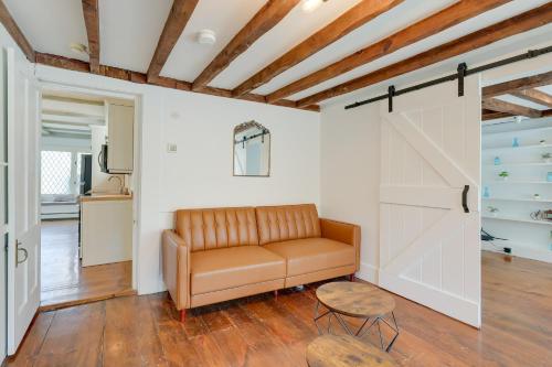 a living room with a couch and a sliding door at Idyllic Escape with Deck in East Sandwich! in East Sandwich