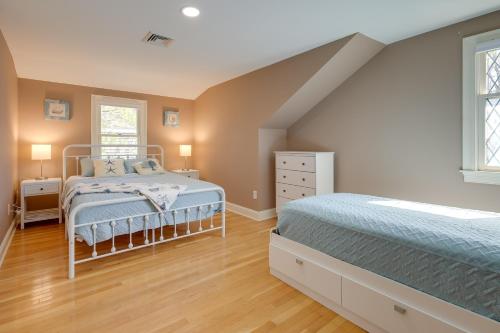 a bedroom with two beds in a attic at 1 Mi to Beach Spacious Retreat in East Sandwich! in East Sandwich