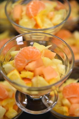 a bowl of fruit with oranges and other vegetables at Hotel Okinawa in Rimini