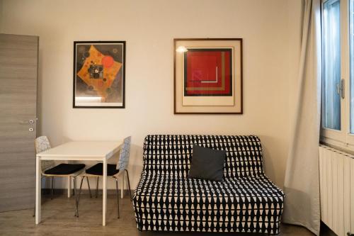 a living room with a table and a couch at Country Resort Modena in Modena