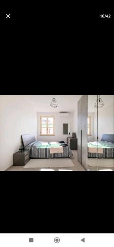 Ένα ή περισσότερα κρεβάτια σε δωμάτιο στο A Casa di Gi