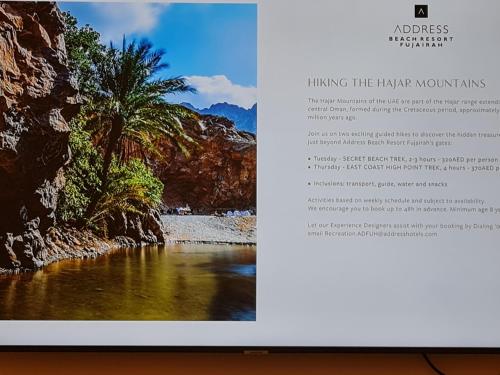 a page of a book with a picture of a river at Two Bedroom-The Address Beach Resort Fujairah in Sharm