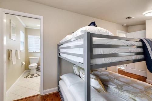 a bunk bed in a room with a bathroom at Woodlands Vacation Home in Little Elm/ Frisco TX in Little Elm