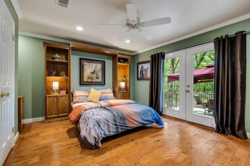 a bedroom with a bed and a ceiling fan at Woodlands Vacation Home in Little Elm/ Frisco TX in Little Elm