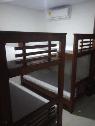a wooden bunk bed with a desk in a room at Aparta hotel yolivacanza I in Leticia