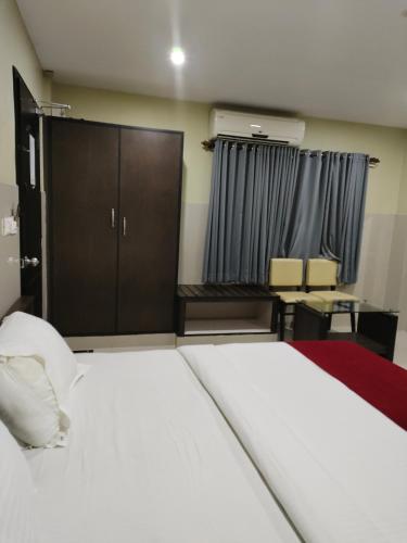 Katil atau katil-katil dalam bilik di Kottavathil Hotel