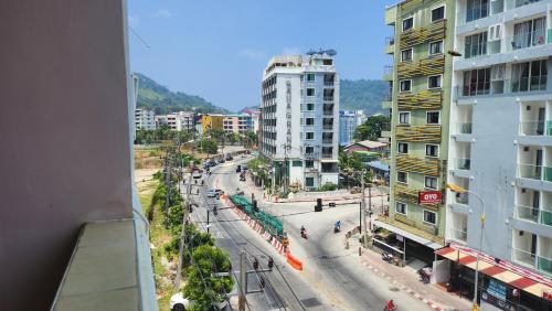 a view of a street in a city with buildings at Chalita House in Patong Beach