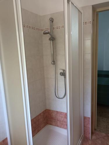 a shower with a glass door in a bathroom at Casa Teresina in Cannole
