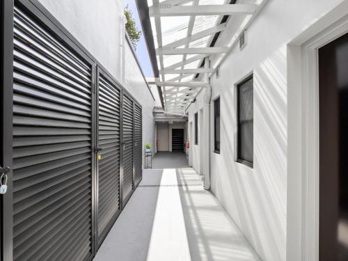an empty hallway of a building with a ceiling at Azzurro Boutique Hotel - Surry Hills in Sydney