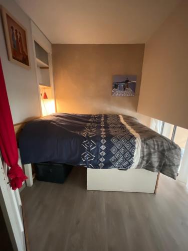 Postel nebo postele na pokoji v ubytování Quartier de l'Aiguillon