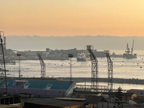 a view of a body of water with a harbor at Hotel Pacífic Suites Tocopilla in Tocopilla
