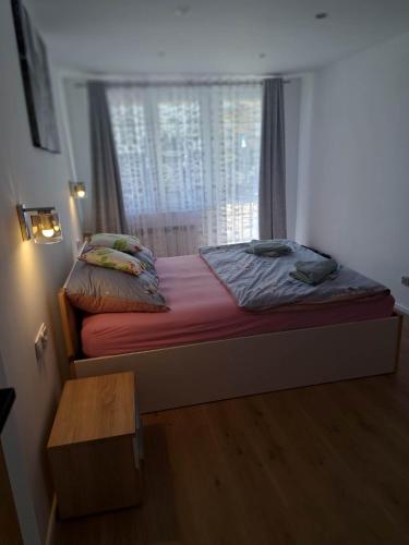 Cama ou camas em um quarto em Apartamenty u Magdy