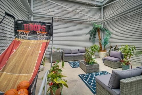a patio with a basketball hoop and a basketball court at Serene Lakefront Mountain Home Getaway with Atrium! in Mountain Home